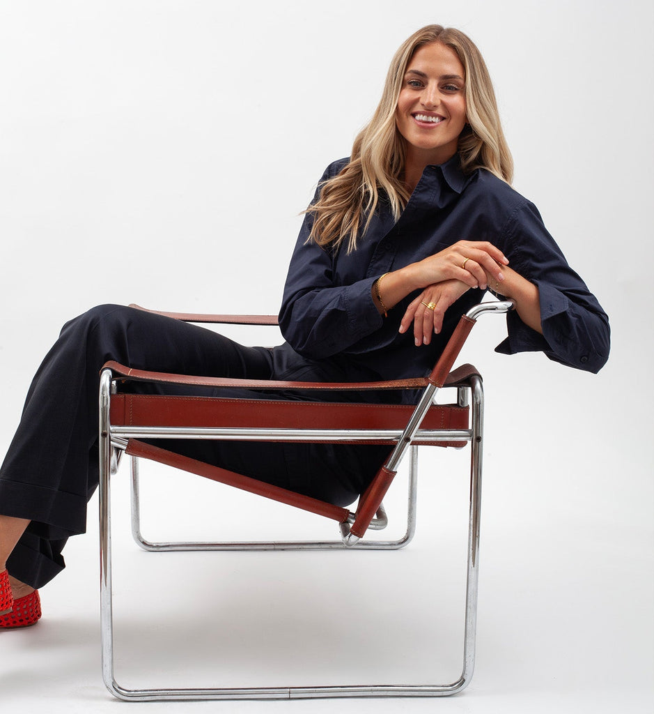Jaclyn Cummings sitting in a red chair