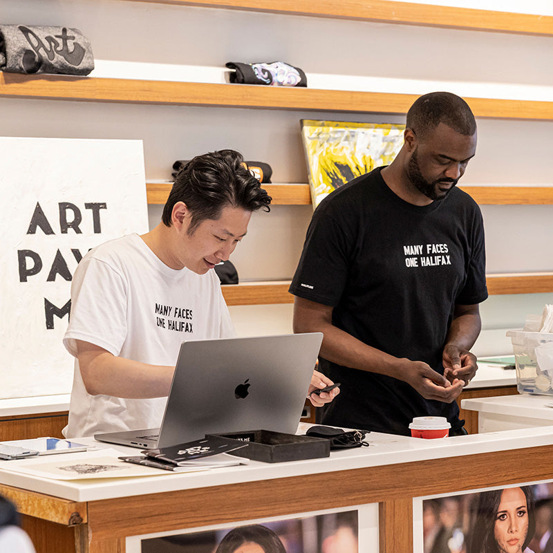 Will Yang (left) and Duane Jones (Right) keeping busy during the HaliTube x Art Pays Me pop up at Halifax Shopping Center