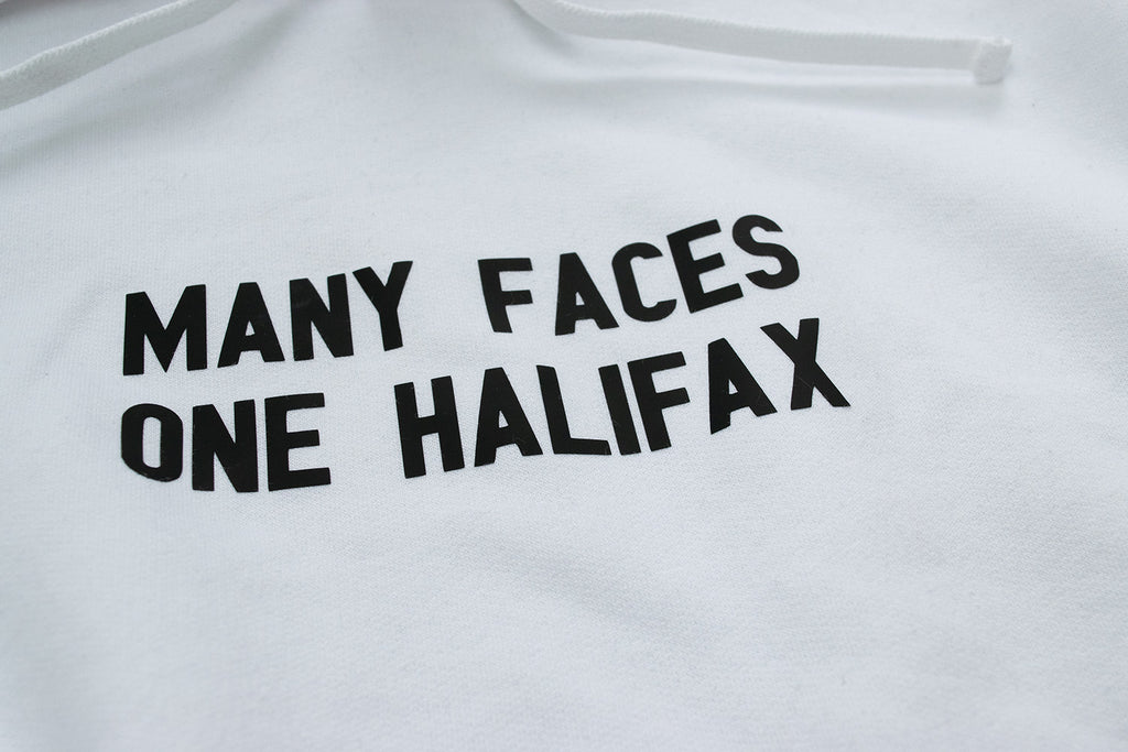 A close up photo of the the Many Faces One Halifax Hoodie