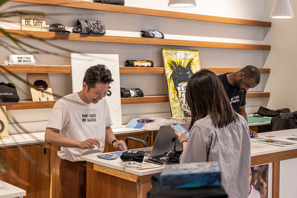 Many Faces One Halifax Tee, White worn by Will Yang at Halifax Shopping Centre. Photo by Emma Lomas.