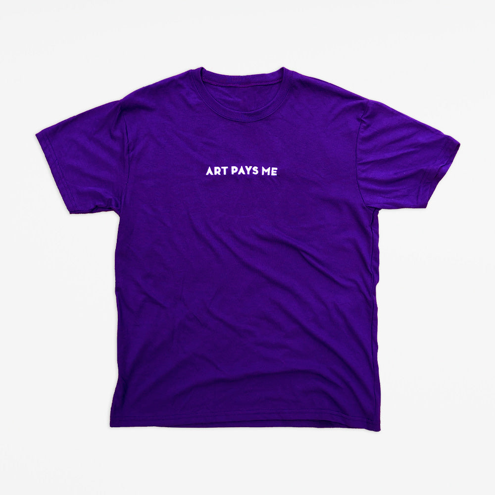 Purple 50/50 ring spun poly/cotton t-shirt with Art Pays Me embroidered on the chest in white thread.